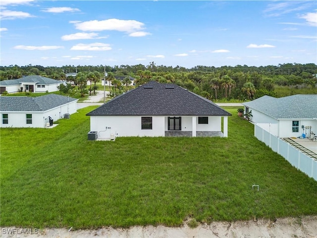 2813 24th St W, Lehigh Acres, FL 33971 - rear view of house featuring stucco siding and a shingled roof