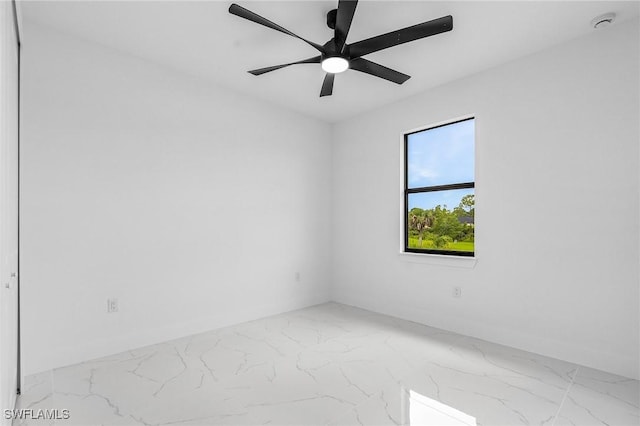 2813 24th St W, Lehigh Acres, FL 33971 - unfurnished room with marble look tile flooring, a ceiling fan, and a smoke detector