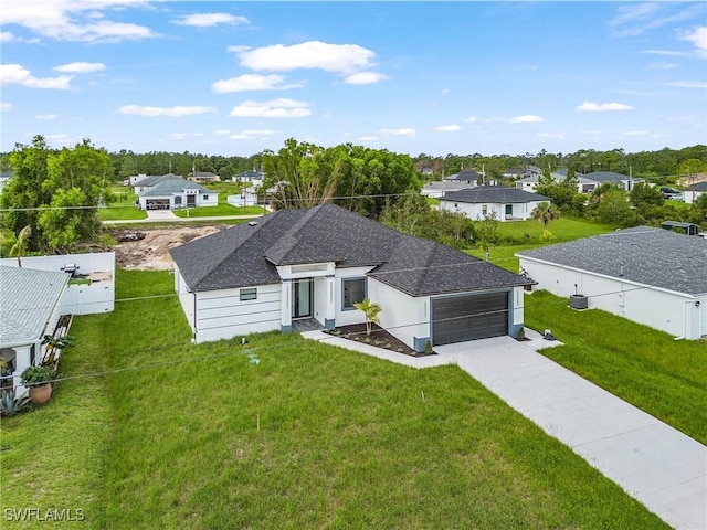 2813 24th St W, Lehigh Acres, FL 33971 - view of front of house featuring a residential view, driveway, and a garage