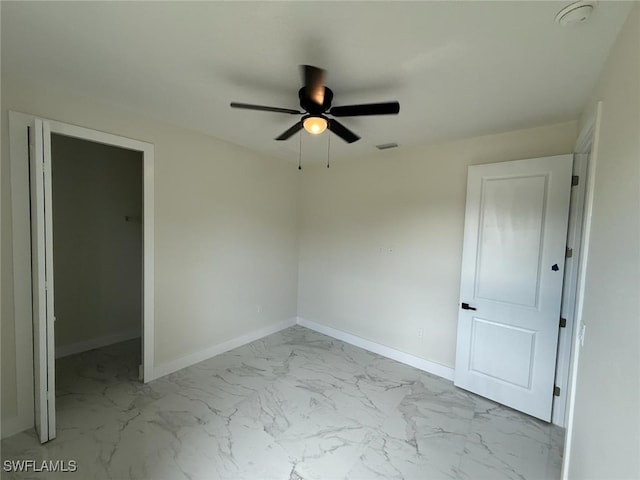 3832 Insdale St, Fort Myers, FL 33905 - unfurnished bedroom with marble finish floors and a ceiling fan