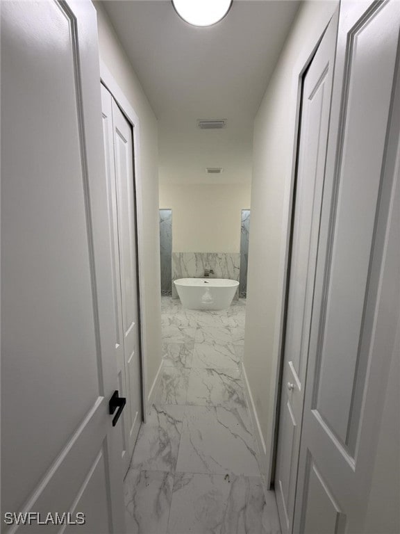 3832 Insdale St, Fort Myers, FL 33905 - hall with light marble finish flooring and baseboards