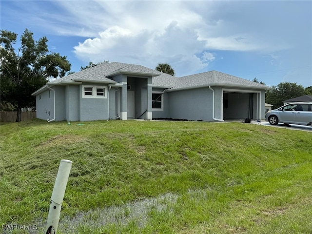 3832 Insdale St, Fort Myers, FL 33905 - prairie-style home with a garage and stucco siding