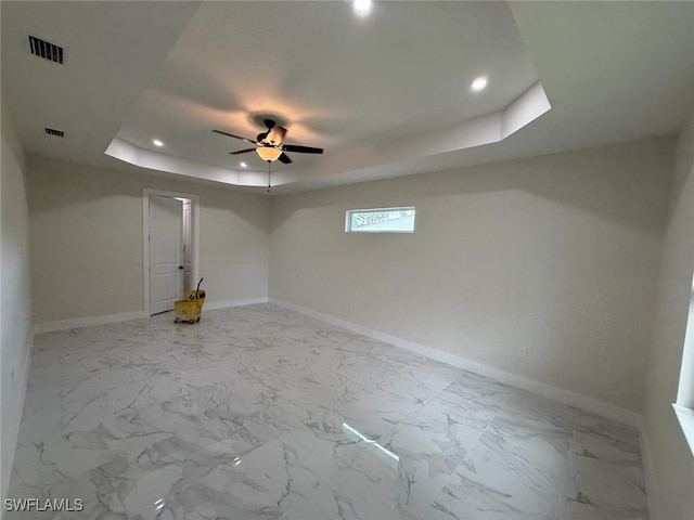 3832 Insdale St, Fort Myers, FL 33905 - unfurnished room featuring a tray ceiling, ceiling fan, recessed lighting, and marble finish flooring