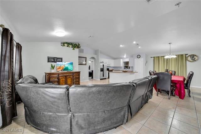 3031 36th St SW, Lehigh Acres, FL 33976 - living area featuring lofted ceiling, a chandelier, and light tile patterned floors