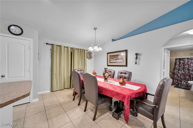 3031 36th St SW, Lehigh Acres, FL 33976 - dining area with vaulted ceiling, a chandelier, arched walkways, and light tile patterned floors