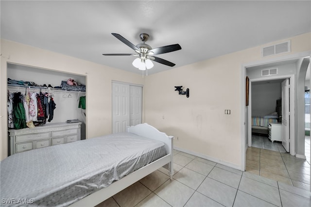 3031 36th St SW, Lehigh Acres, FL 33976 - bedroom with light tile patterned floors, multiple closets, and ceiling fan