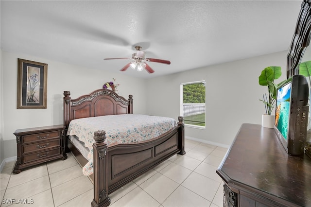 3031 36th St SW, Lehigh Acres, FL 33976 - bedroom with light tile patterned floors and a ceiling fan