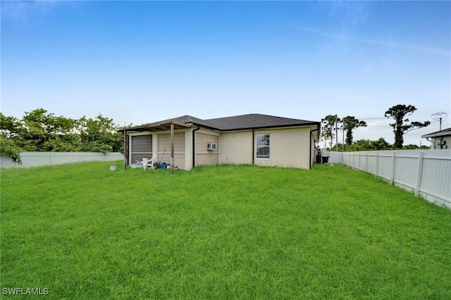 3031 36th St SW, Lehigh Acres, FL 33976 - rear view of house with stucco siding