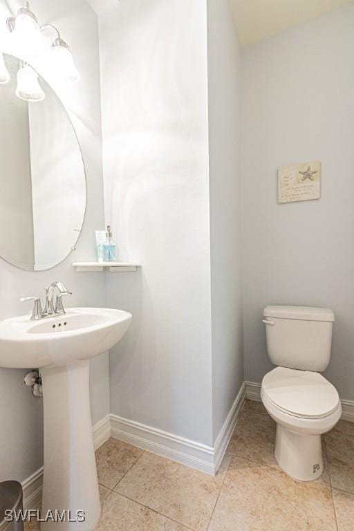 7907 Bristol Cir, Naples, FL 34120 - half bath featuring baseboards and tile patterned flooring