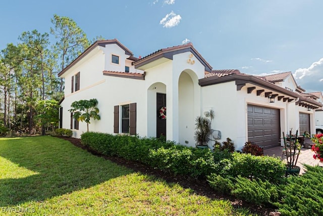 7907 Bristol Cir, Naples, FL 34120 - mediterranean / spanish home featuring a garage, stucco siding, a tile roof, and a front yard