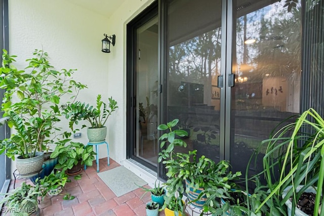 7907 Bristol Cir, Naples, FL 34120 - view of exterior entry featuring stucco siding