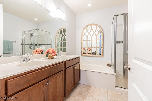 7907 Bristol Cir, Naples, FL 34120 - full bathroom with a shower stall, a garden tub, double vanity, tile patterned floors, and recessed lighting