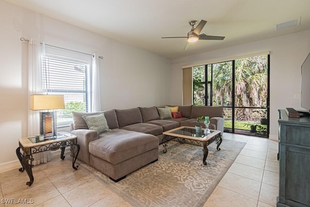 7907 Bristol Cir, Naples, FL 34120 - living room featuring ceiling fan and light tile patterned floors