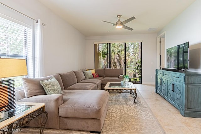 7907 Bristol Cir, Naples, FL 34120 - living room with healthy amount of natural light, light tile patterned floors, and ceiling fan