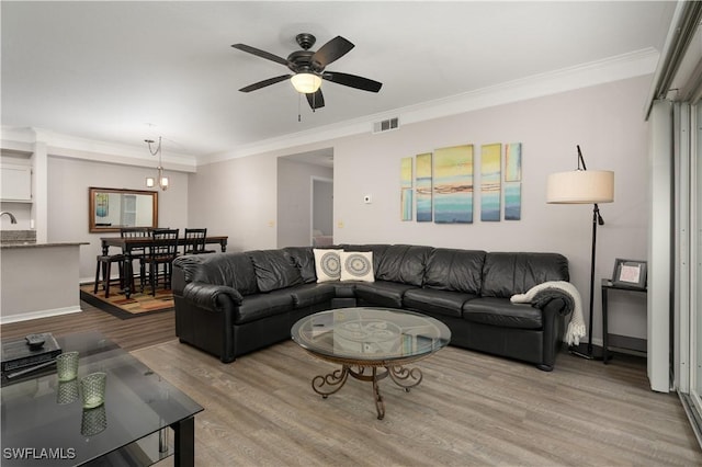 11500 Villa Grand Unit 310, Fort Myers, FL 33913 - living area with crown molding, wood finished floors, and ceiling fan