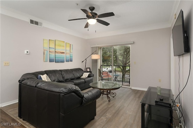11500 Villa Grand Unit 310, Fort Myers, FL 33913 - living room with wood finished floors, a ceiling fan, and ornamental molding