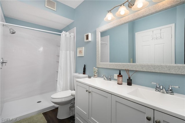 11500 Villa Grand Unit 310, Fort Myers, FL 33913 - full bathroom with double vanity, a shower with shower curtain, and wood finished floors