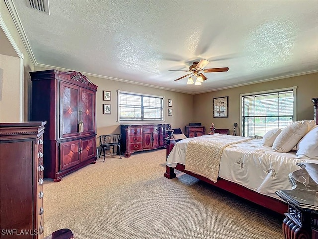 24454 Nova Ln, Punta Gorda, FL 33980 - bedroom featuring a textured ceiling, light carpet, multiple windows, crown molding, and ceiling fan