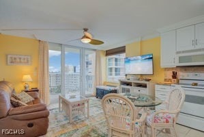 7360 Estero Blvd Unit 703, Fort Myers Beach, FL 33931 - tiled dining area with ceiling fan and a wall of windows