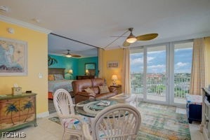 7360 Estero Blvd Unit 703, Fort Myers Beach, FL 33931 - dining room featuring a ceiling fan, crown molding, and tile patterned flooring