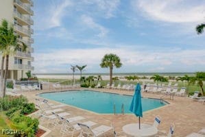 7360 Estero Blvd Unit 703, Fort Myers Beach, FL 33931 - community pool featuring a patio