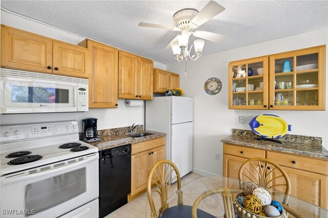 8701 Estero Blvd Unit 105, Bonita Springs, FL 33931 - kitchen with white appliances, a ceiling fan, glass insert cabinets, light tile patterned floors, and a textured ceiling