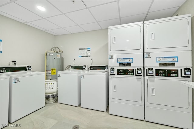 8701 Estero Blvd Unit 105, Bonita Springs, FL 33931 - community laundry with stacked washing machine and dryer, electric water heater, and washing machine and clothes dryer