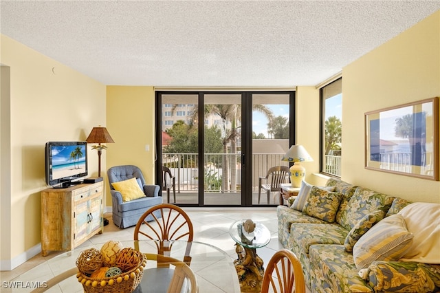8701 Estero Blvd Unit 105, Bonita Springs, FL 33931 - living area with light tile patterned floors, a textured ceiling, and a wall of windows