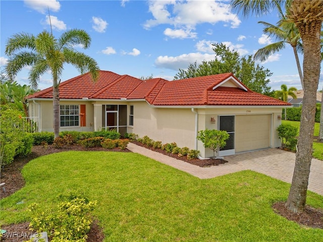 17936 Courtside Landings Cir, Punta Gorda, FL 33955 - view of front facade featuring a garage, decorative driveway, stucco siding, a front lawn, and a tile roof