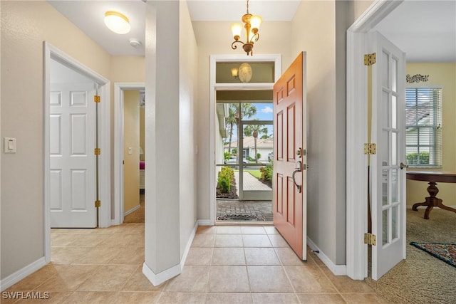 17936 Courtside Landings Cir, Punta Gorda, FL 33955 - foyer entrance with light tile patterned floors and baseboards