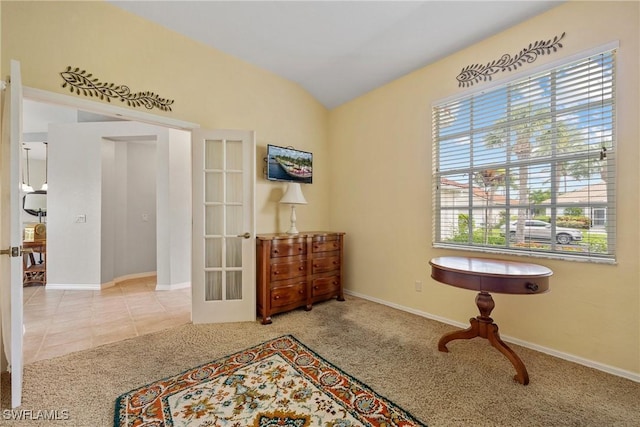 17936 Courtside Landings Cir, Punta Gorda, FL 33955 - living area featuring carpet, french doors, vaulted ceiling, and tile patterned flooring