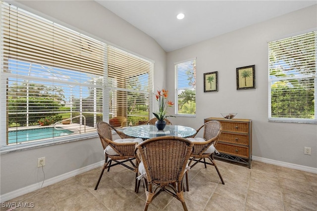 17936 Courtside Landings Cir, Punta Gorda, FL 33955 - dining area featuring lofted ceiling, healthy amount of natural light, and light tile patterned floors