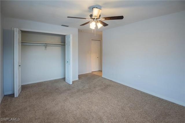 180 Cypress Way E Unit B212, Naples, FL 34110 - unfurnished bedroom featuring carpet, a closet, and ceiling fan