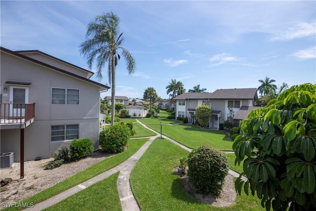 180 Cypress Way E Unit B212, Naples, FL 34110 - view of grassy yard with a residential view
