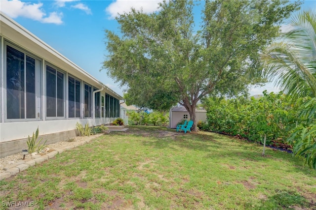 304 NW 22nd Ave, Cape Coral, FL 33993 - view of green lawn with a storage unit and a sunroom