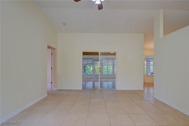 304 NW 22nd Ave, Cape Coral, FL 33993 - spare room featuring ceiling fan, light tile patterned floors, and high vaulted ceiling