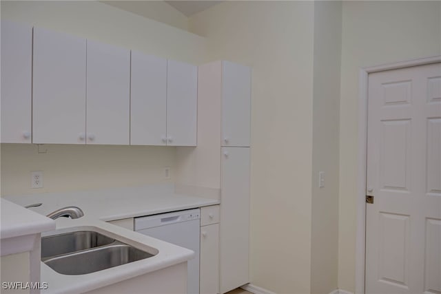 304 NW 22nd Ave, Cape Coral, FL 33993 - kitchen with white dishwasher, white cabinetry, and light countertops