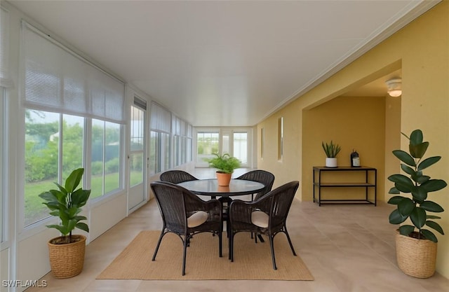 304 NW 22nd Ave, Cape Coral, FL 33993 - sunroom featuring tile patterned flooring and ornamental molding