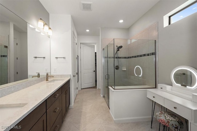 16569 Windsor Way, Alva, FL 33920 - bathroom featuring a shower stall, double vanity, recessed lighting, and tile patterned flooring