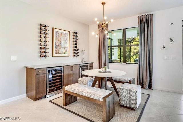 16569 Windsor Way, Alva, FL 33920 - dining room with wine cooler, a dry bar, light tile patterned flooring, and a chandelier