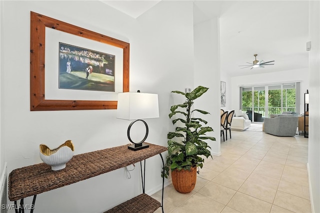 3425 Laurel Greens Ln S Unit 203, Naples, FL 34119 - hall with light tile patterned floors and vaulted ceiling