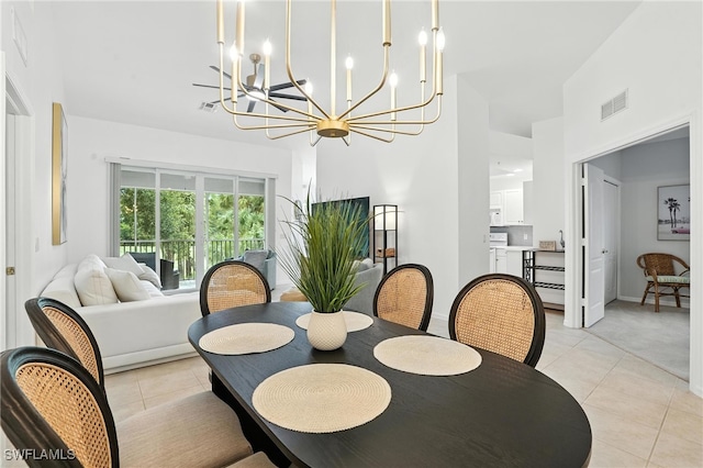3425 Laurel Greens Ln S Unit 203, Naples, FL 34119 - dining room with a chandelier, a towering ceiling, and light tile patterned floors