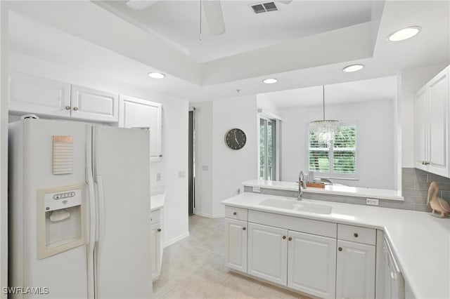3425 Laurel Greens Ln S Unit 203, Naples, FL 34119 - kitchen with white appliances, white cabinets, a peninsula, recessed lighting, and ceiling fan
