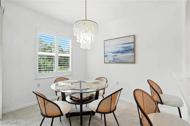 3425 Laurel Greens Ln S Unit 203, Naples, FL 34119 - dining room featuring a chandelier and light tile patterned floors