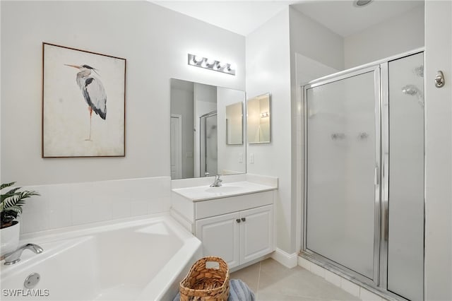 3425 Laurel Greens Ln S Unit 203, Naples, FL 34119 - bathroom featuring a shower stall, vanity, a bath, and tile patterned flooring