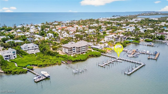33 Urchin Ct, Captiva, FL 33924 - aerial view of residential area featuring a large body of water and a marina