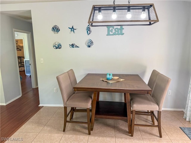 5870 Star Grass Ln, Naples, FL 34116 - dining area with baseboards and tile patterned flooring