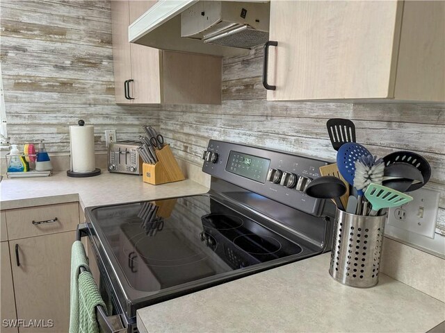 5870 Star Grass Ln, Naples, FL 34116 - kitchen featuring range with electric stovetop, exhaust hood, light countertops, and light brown cabinetry