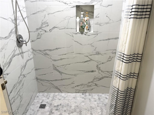5870 Star Grass Ln, Naples, FL 34116 - bathroom featuring a marble finish shower