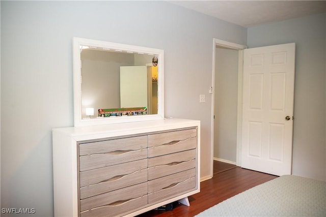 5870 Star Grass Ln, Naples, FL 34116 - bedroom with dark wood-style floors